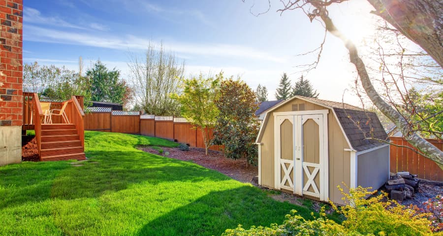 Fenced backyard with storage shed in Memphis